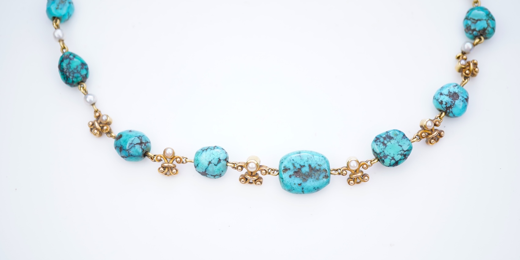 A turquoise and seed pearl necklace, early 20th century